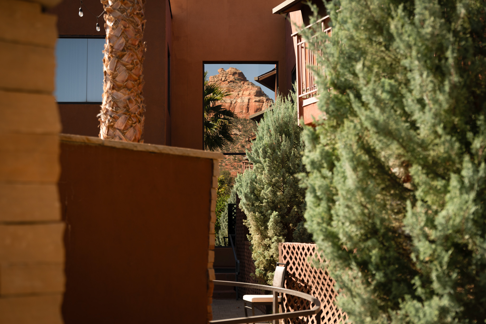 A guest room balcony with a view of the red rocks