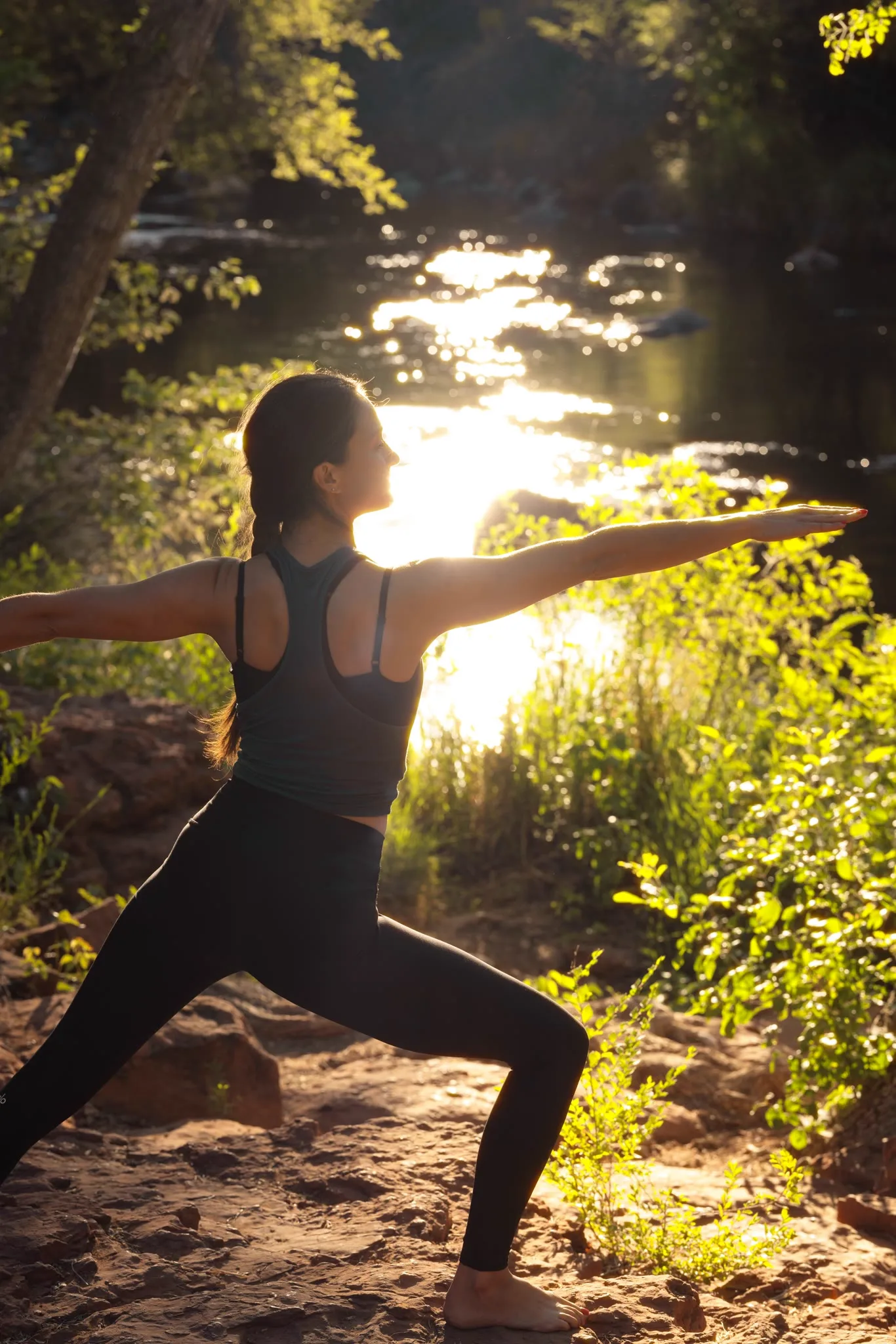 Yoga on the creek bank at sunrise