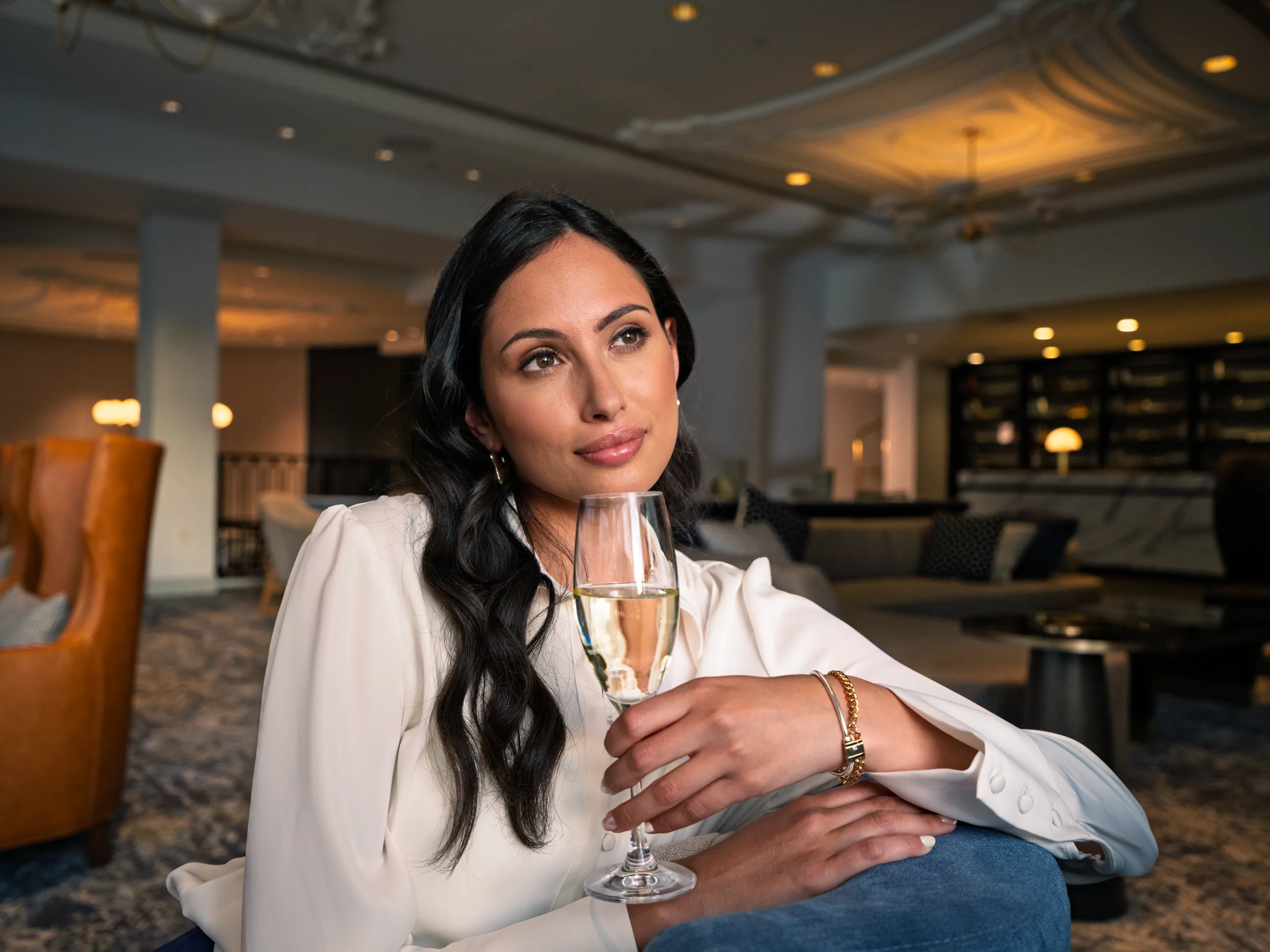 A guest holds a glass of champagne
