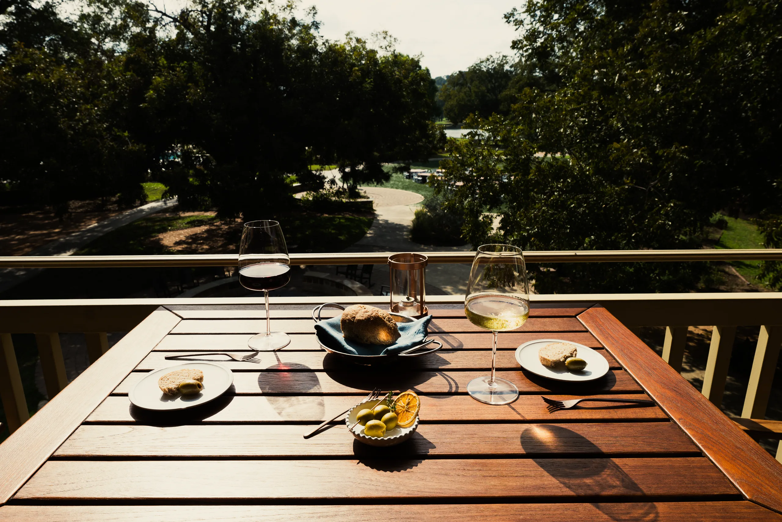 Wine and olives on a balcony over the grounds