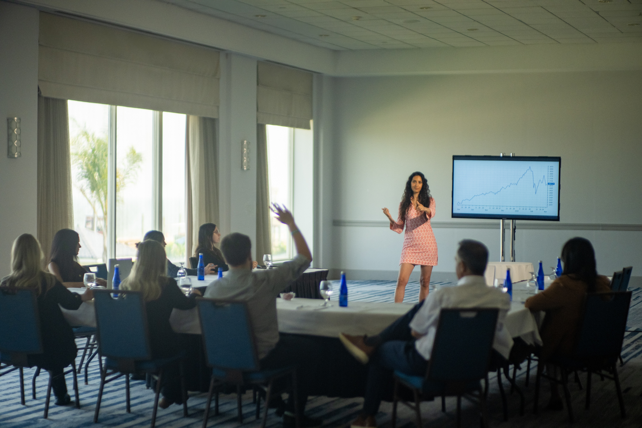 A presenter leads a meeting room session