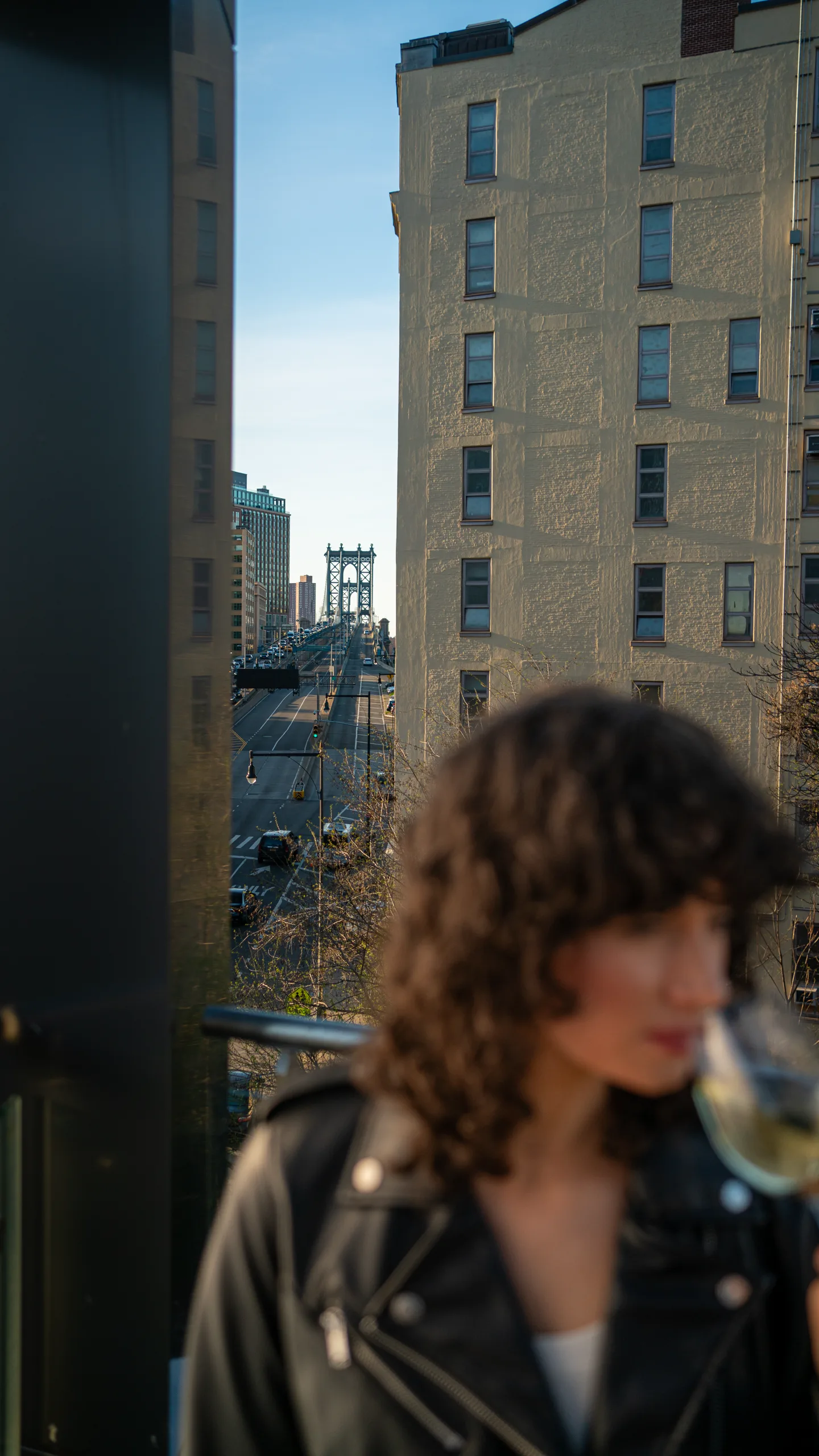 The Manhattan Bridge framed between buildings